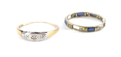 Two dress rings, comprising a diamond set three stone dress ring with three tiny diamonds in a platinum rub over setting, on a yellow metal band stamped 375, together with a silver eternity ring (AF), 1.7g all in.