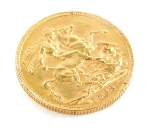 An Edward VII 1903 full gold sovereign.