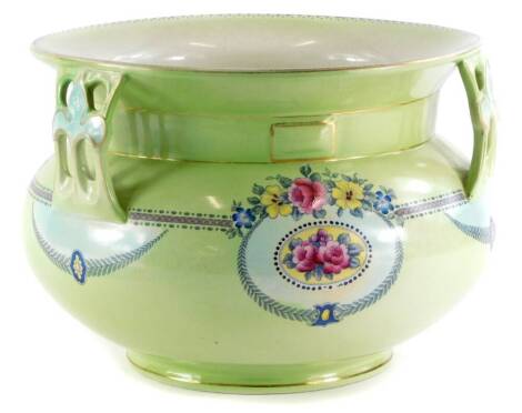 A Leighton pottery Art Nouveau shaped jardiniere, with three pierced handles, printed and painted decoration of flower sprays, etc., printed marks to underside, the top 27.5cm diameter.