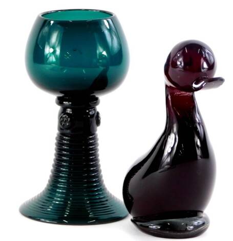 A German green tinted hoch glass, with a ribbed tapering foot, 14cm high, and a ruby tinted glass duck, possibly Wedgwood.