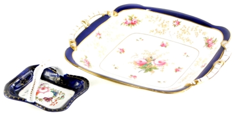 A 19thC Staffordshire porcelain basket, painted centrally with flower spray within a cobalt blue band, and a similar Coalport two handled cake plate, retailed by Townsend of Newcastle, printed and painted with roses, etc. (2)