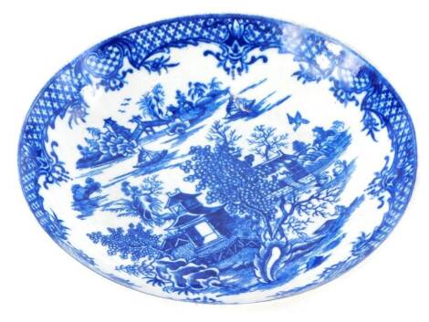 An 18thC Worcester porcelain saucer dish, printed in blue with oriental scenes of buildings, boats, etc., crescent mark to underside, 19.5cm diameter.