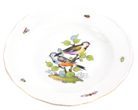 A Meissen porcelain soup plate, later decorated with birds on a branch, insects, etc., cross swords mark in blue to underside, struck through, 24.5cm diameter.