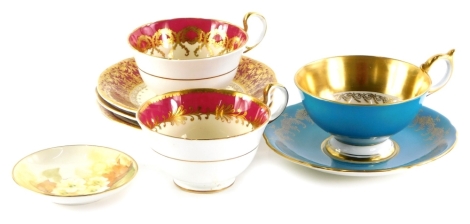 A part Harlequin set of Aynsley cups and saucers, differing designs and colours, to include three cups, four saucers and a Royal Worcester pin tray decorated with flowers, indistinctly signed.