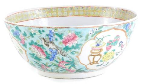 A Chinese porcelain bowl, decorated in raised enamels in famille rose Palette, with flowers, vases, and other motifs, the interior with a geometric band in pink, red and yellow, unmarked, 28.5cm diameter, (AF).