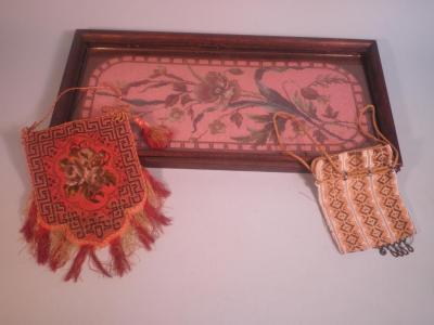 A 19thC beadwork picture decorated with a flower and leaves