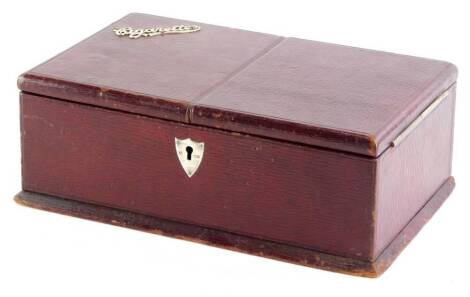 A maroon tooled leather cigarette box, with silver name to top and escutcheon, with cedar lined interior, 25.5cm wide.