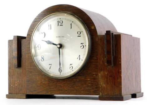 An Art Deco mantel clock, the silvered dial stamped Walker and Hall, 30cm wide.