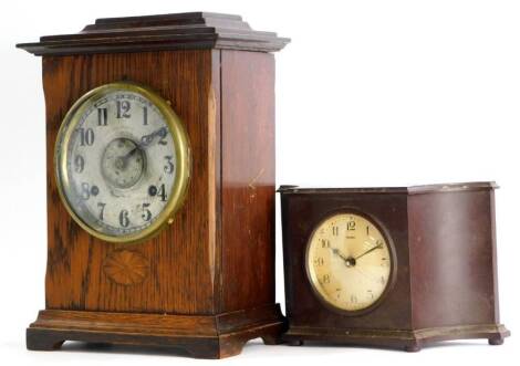 Two mantel clocks, one in an oak case, the dial stamped Fattorini and Sons Limited Bradford, the other in a brown Bakelite case, stamped Ferranti.