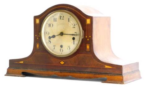 An early 20thC mahogany cased mantel clock, with a silvered dial, the case inlaid in mother of pearl and marquetry, in Art Nouveau style, 46cm wide.