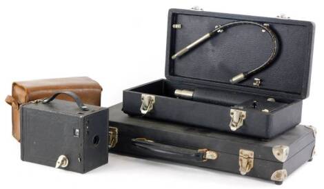 An Engineering Development Limited illuminated medical probe, with various attachments, etc., in fitted case, and a similar medical inspection set, stamped Goatlands in a fitted case, and a boxed Brownie camera. (3)