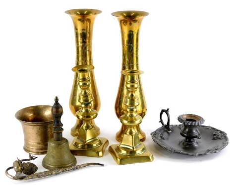 A collection of metalware, to include a bronze mortar, pair of candlesticks, pair of vases, Britannia metal chamber stick, a brass bell and an Eastern pipe with filigree decoration.