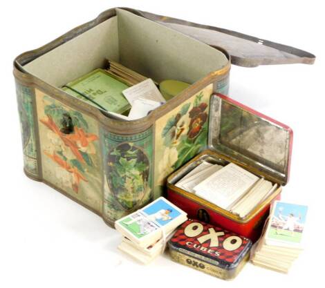 A collection of cigarette cards, mainly Gallaghers Park Drive, some tea cards, and various tins.