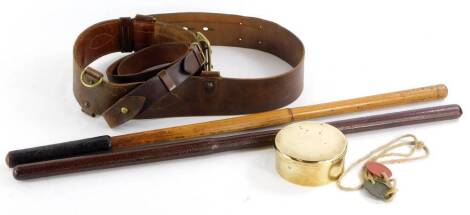 A collection of items, to include two leather and part leather swagger type sticks, leather belts, a brass box and cover, and a military dog tags bearing the name G.L Robbins.