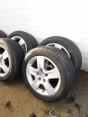 Four Audi A4 alloy wheels with hubcaps, and assorted tyres, and a Ford Mondeo wheel with hubcap and tyre. (5) - 2