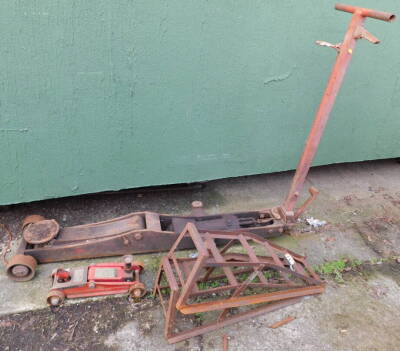 A mechanic's trolley jack, a pair of car ramps, and a Sprint hydraulic trolley jack. (4)