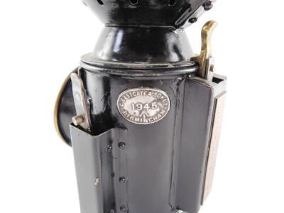 A WWII C. Eastgate & Son Ltd military issue railway lamp, black painted with oval plaque C. Eastgate & Son Birmingham 1945 and crows feet marking, and a copper rectangular location plate London & North Eastern RLY Yarmouth South Town No.8, 33cm high. - 3