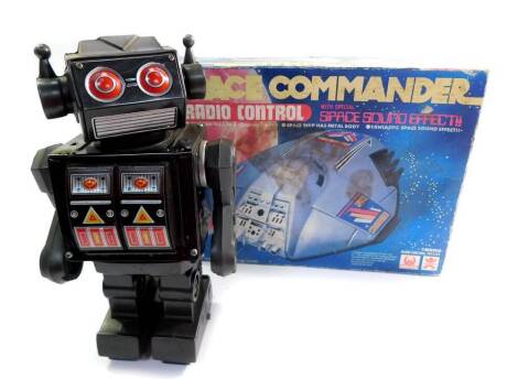 A Hales Radio Controlled Space Commander, with Special Space sound effect, 16552, boxed, together with a Japanese tin plate battery operated walking robot, with light effect attack guns. (2)