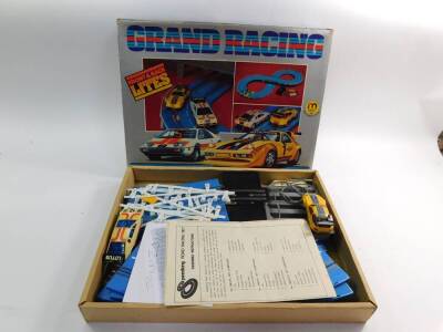 A Lincoln International High-Rev battery operated slot racing set, with revving motor roar, set no 2, together with a Hong Kong battery operated Grand Racing set, no 7642/PLBW, both boxed. (2) - 2