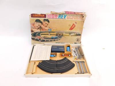 A Lincoln International High-Rev battery operated slot racing set, with revving motor roar, set no 2, together with a Hong Kong battery operated Grand Racing set, no 7642/PLBW, both boxed. (2) - 3