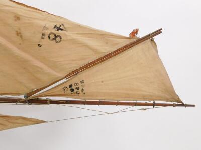 A wooden scale model of a single masted yacht, fully rigged, on a stand, 138cm wide. - 4