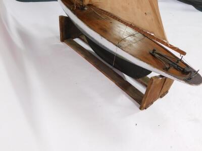 A wooden scale model of a single masted yacht, fully rigged, on a stand, 138cm wide. - 6