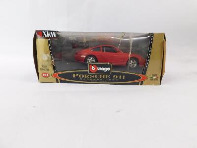 Four Burago Bijoux Collection die cast cars, 1:24 scale, comprising Mini Cooper., Porsche 911 Carrera (1997)., BMW M Roadster (1996)., and Ferrari 550 Maranello (1996), all boxed. - 2