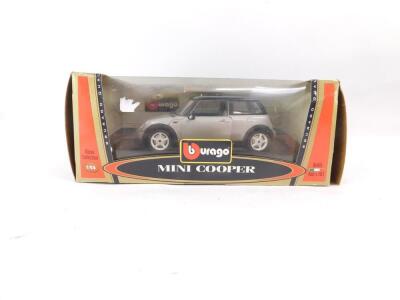 Four Burago Bijoux Collection die cast cars, 1:24 scale, comprising Mini Cooper., Porsche 911 Carrera (1997)., BMW M Roadster (1996)., and Ferrari 550 Maranello (1996), all boxed. - 3