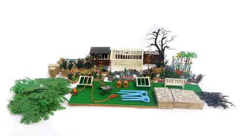 A Britains Limited plastic floral garden, with greenhouse, trees, fencing, etc. (a quantity)