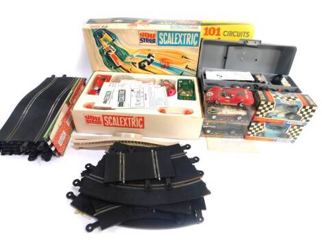 A Scalextric Conversion Set YS200, race tuned Offenhauser front engine C79, a pair of change overs PT82, back bridge A248, long chicane set PT76, right angle crossing PT83, all boxed, together with further track, etc., and 101 Circuits for Scalextric Driv