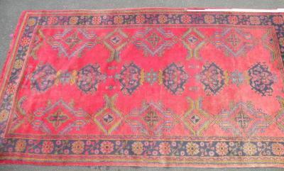 A Turkey carpet, with a design of medallions, on a red ground