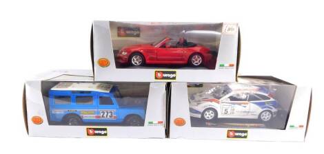 Three BB Burago Collection die cast cars, 1:24 scale, comprising a Ford Focus WRC., Land Rover Defender., and BMW Roadster, all boxed.