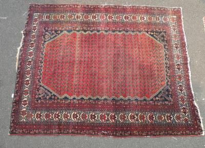 A Persian type rug, with a design of botei on a red ground, with