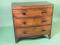 An early 19thC mahogany and ebony strung bow fronted chest of drawers