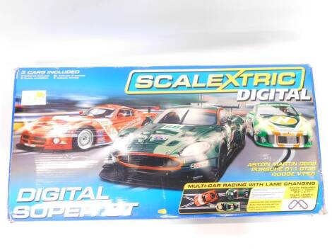 A Scalextric Digital Super GT Set, including an Aston Martin DBR9, Porsche 911GT3R, and a Dodge Viper, boxed.