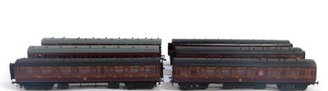 Three Exley OO gauge GWR coaches, first/third class, together with two LMS third class coaches, and an Exley third class corridor coach with guard's section. (6)