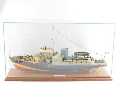 A scale model of a Royal Canadian Mounted Police Boat 'McDonald', with figures, cased, 47cm high, 91cm wide.