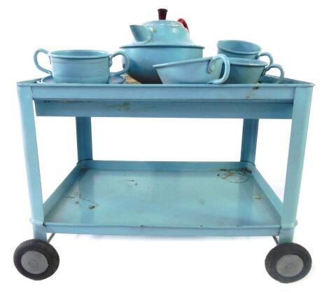 A Chad Valley Toys tea trolley, complete with tea set. (boxed)