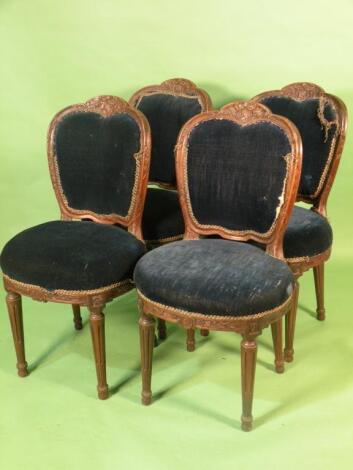 A set of four 19thC French walnut dining chairs