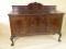 An early 20thC mahogany sideboard with a raised back