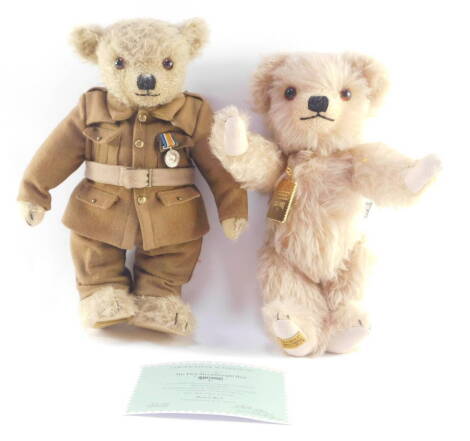 A Merrythought replica of the first Merrythought bear, limited edition no. 83/1931, dressed in the uniform of a WWI soldier, with certificate, together with a Merrythought bear with Royal Mail stamp medallion. (2)