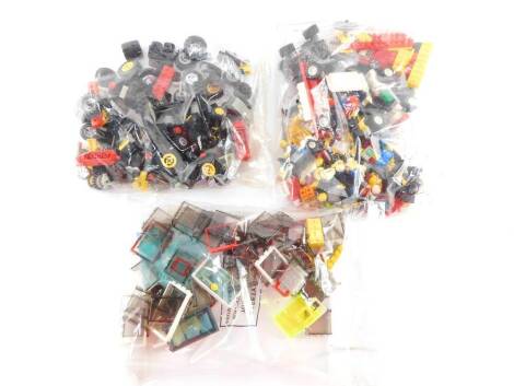 Lego, comprising figures, wheels and motoring related, windows, etc. (a quantity)