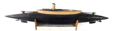 A remote control scale model of an early submarine, on stand, 124cm wide.