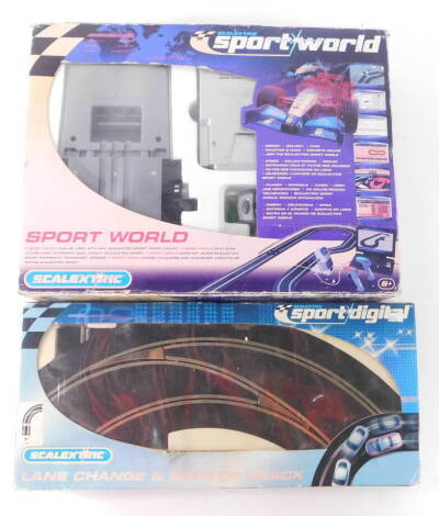 A Scalextric Sport World set, C8310, boxed, together with a lane change and sensor track, boxed. (2)