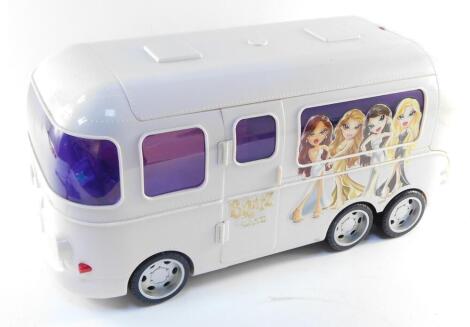 An MGA Entertainment Bratz Rock Angelz white tour bus, with a fitted interior, 56cm wide.