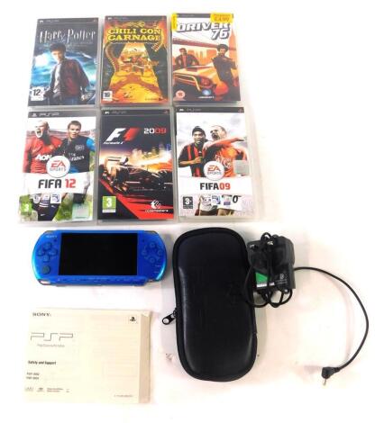 A Playstation PSP console in blue, with carrying case, power cable and six games comprising of Chilli Con Carnage, F! 2009, FIFA 09 & 2012 Driver 76 and Harry Potter and The Half-Blood Prince.