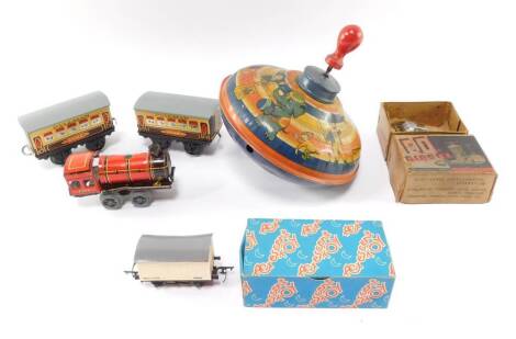 A British tin plate clockwork locomotive, a pair of Hornby O gauge Pullman wagons, Zena and Joan., an ED diesel Tri-ang cattle wagon and a Chad Valley Spinning Top. (5)