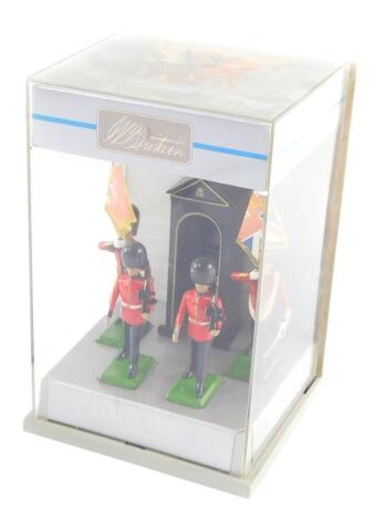 A Britain's die cast Scots Guard set, comprising a pair of armed guardsmen, sentry box and a pair of guardsmen holding ceremonial flags,boxed.