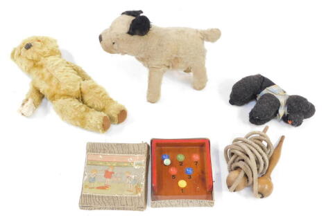 A straw filled dog, figure of a poodle, Teddy Bear, skipping ropes and an early 20thC marble game, boxed. (a quantity)