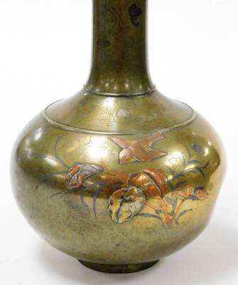 A pair of Japanese inlaid bronze bottle vases with slender elongated necks, inlaid in relief, in gold, silver and copper with birds above flowers, the necks with flat inlay of dragons in clouds, with lappet borders, Meiji period, 40cm high. - 2